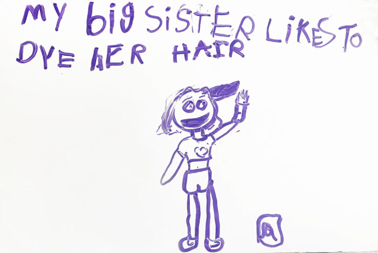 A child's drawing with a caption of my sister dyes her hair