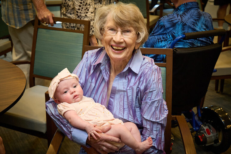 picture of Kathy Nelson's mother at 90 years old holding her great grandchild, Rosie (3 months)